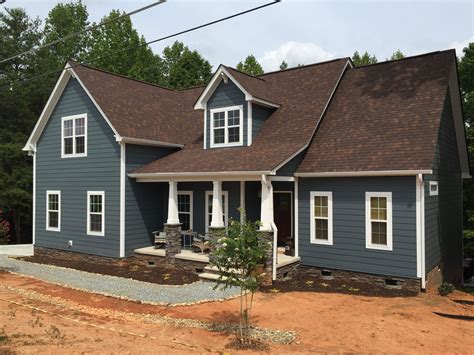 exterior house colors with brown metal roof|brown shingles house color.